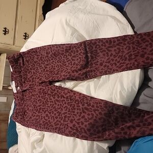 maroon Jean pants with animal print in black... size 4.